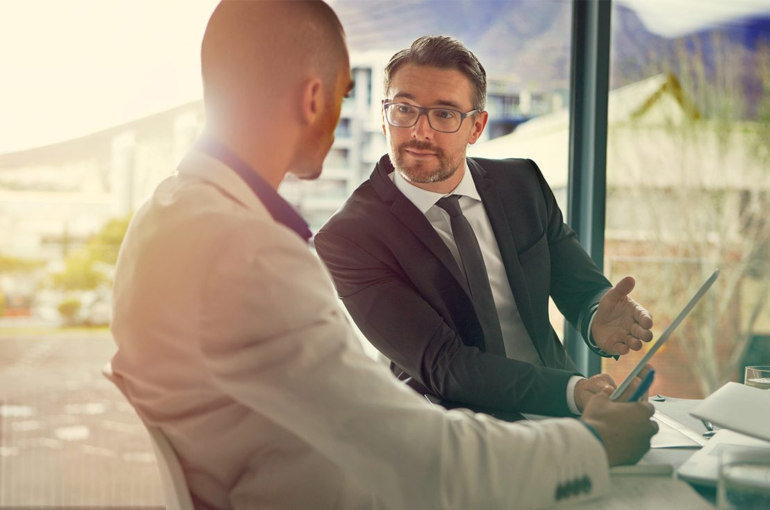 Two men with a tablet